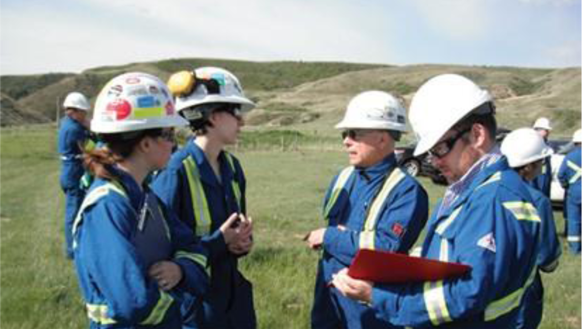 CER inspectors standing in a field