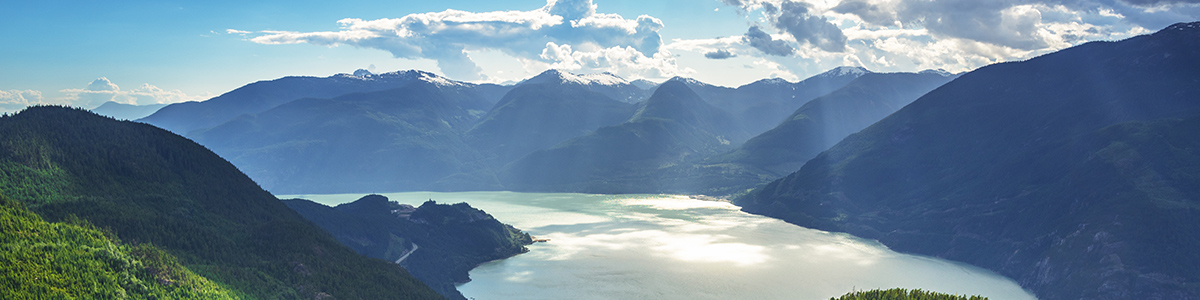 Scenic view of the Howe Sound and the surrounding mountains on a summer day. Squamish, B.C.