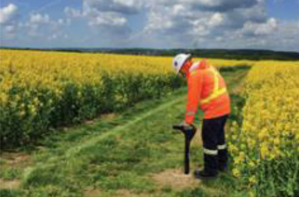 Figure&nbsp;14 &ndash; Company representative locating the pipe and checking for depth.