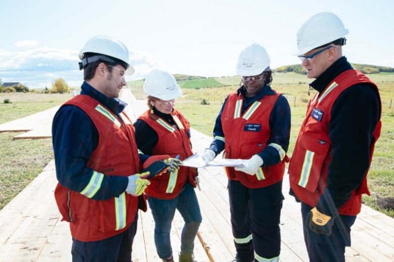 Figure&nbsp;6 &ndash; CER Inspectors reviewing a map along a right-of-way.