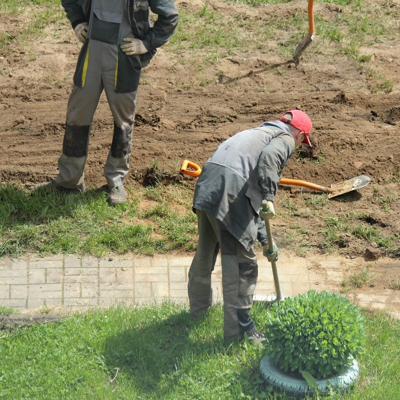 Figure&nbsp;3 &ndash; Crew repairing a walkway and surrounding landscaping.