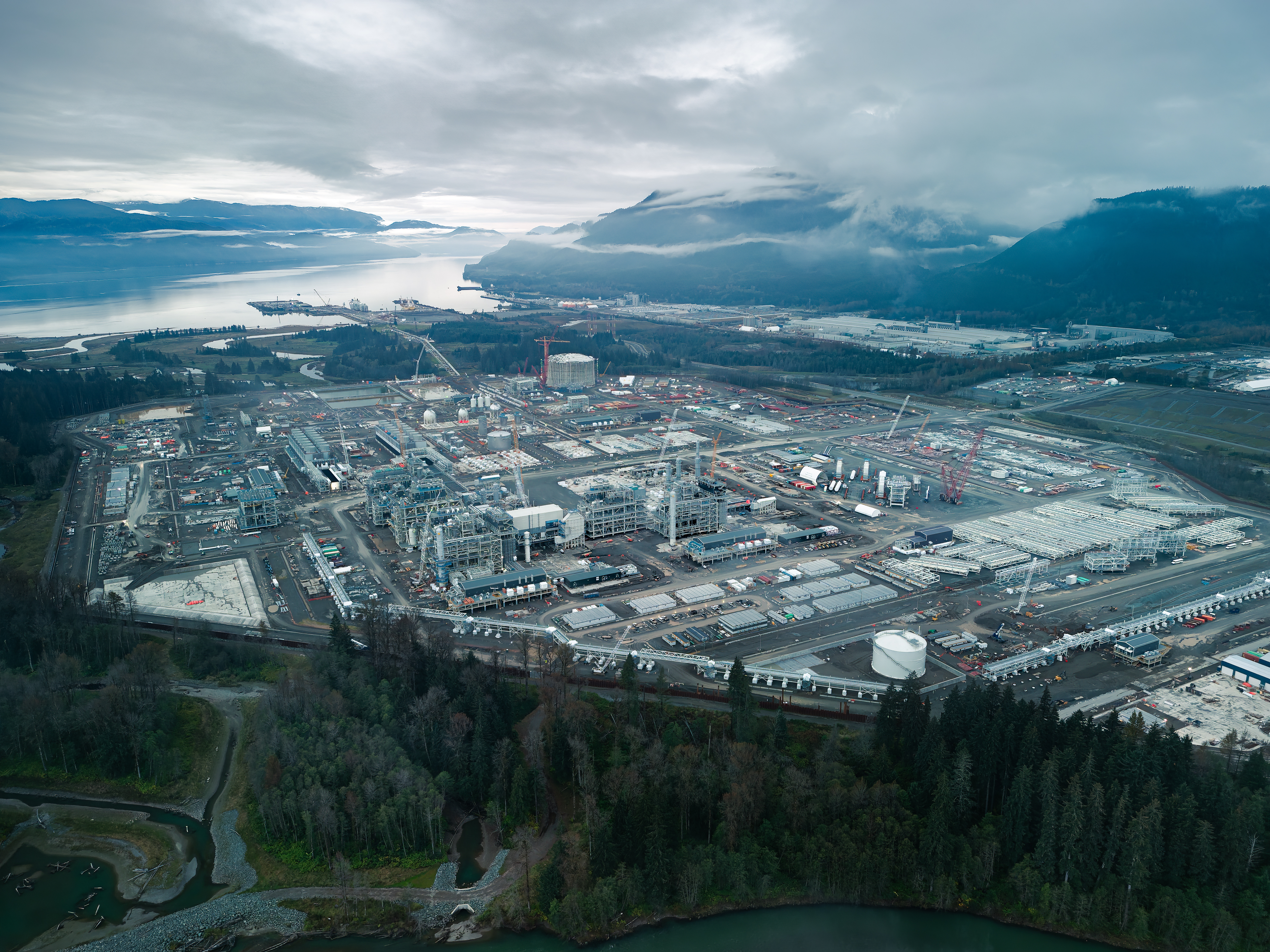 Aerial view of natural gas export terminal construction in northern British Columbia on a cloudy day.