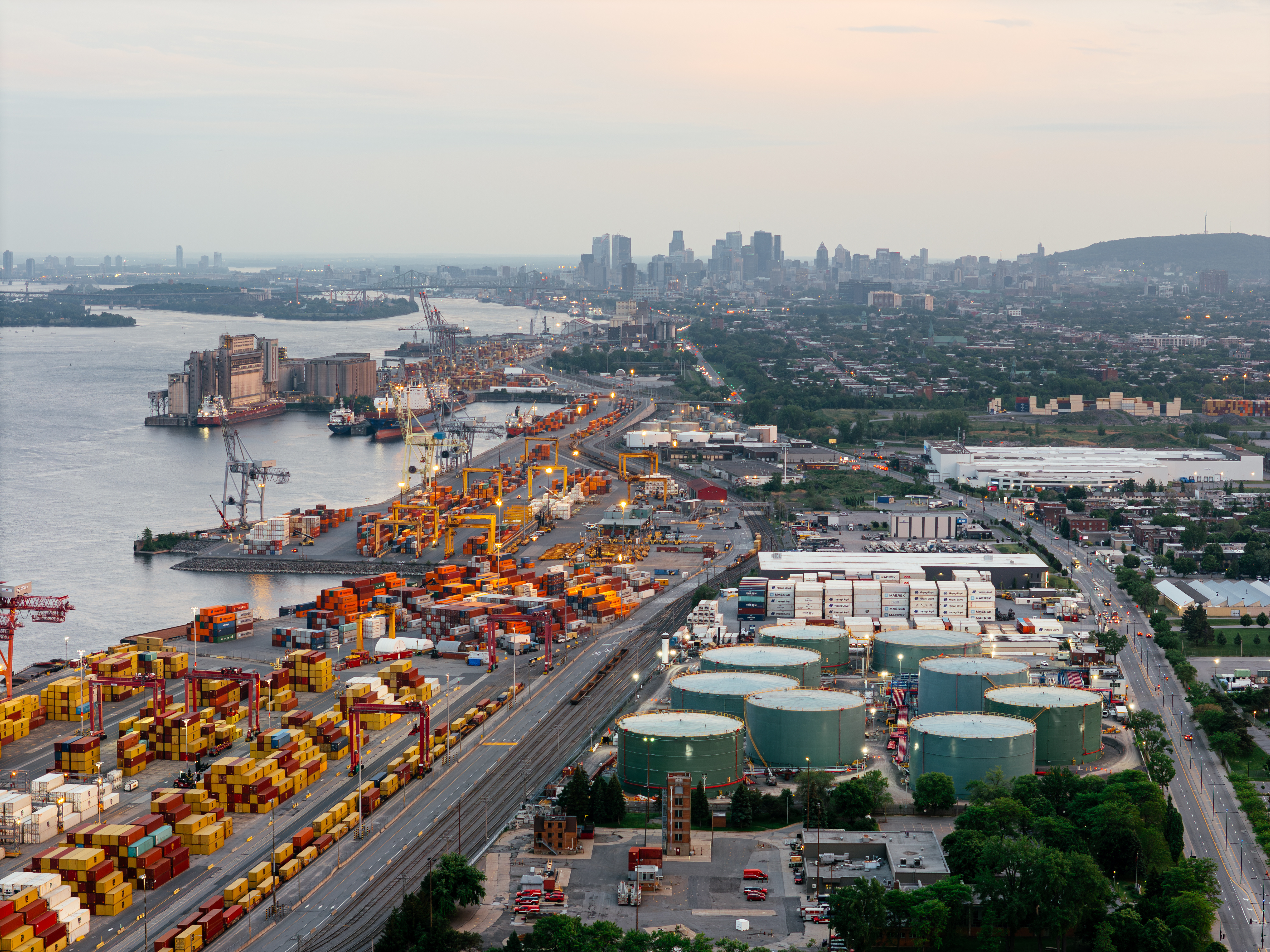Aerial view of old port of Montreal in Canada with the skyline in the background on a partially cloudy day.