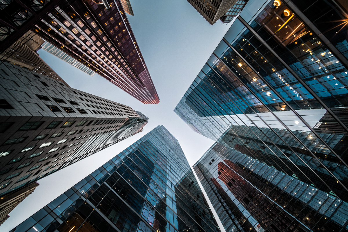 Looking up at high rise office building architecture against blue sky in the financial district of a downtown Toronto, Canada, business and finance concept.