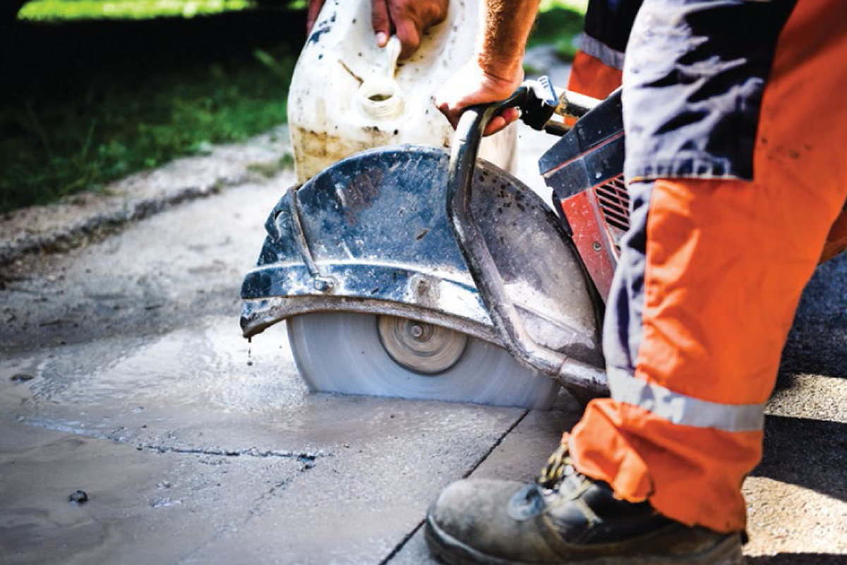 Saw cutting asphalt road surface